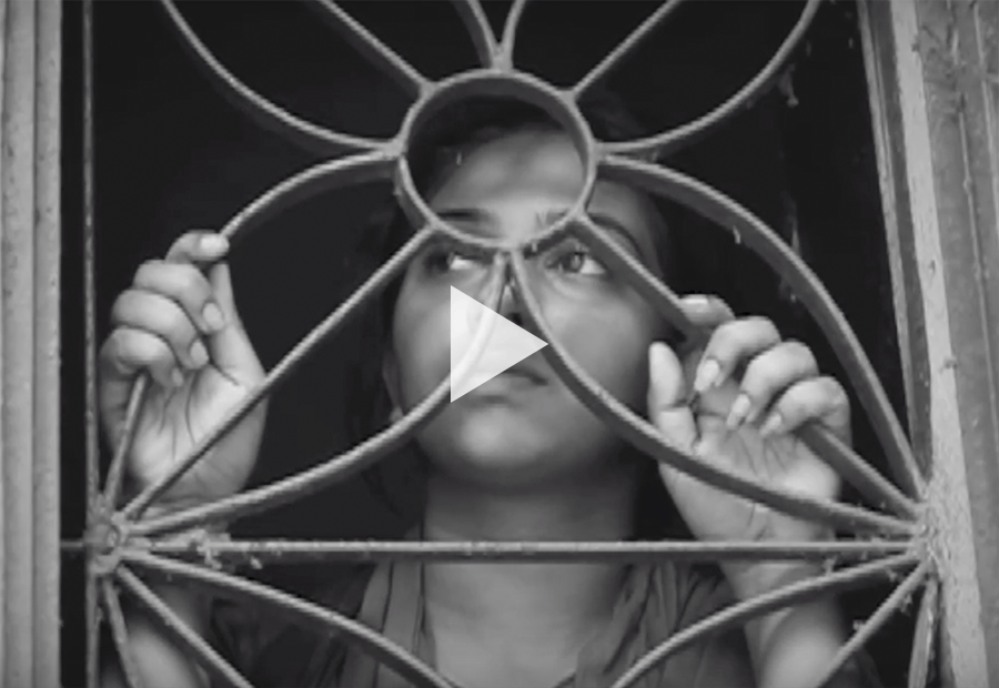 Indian girl behind gated window