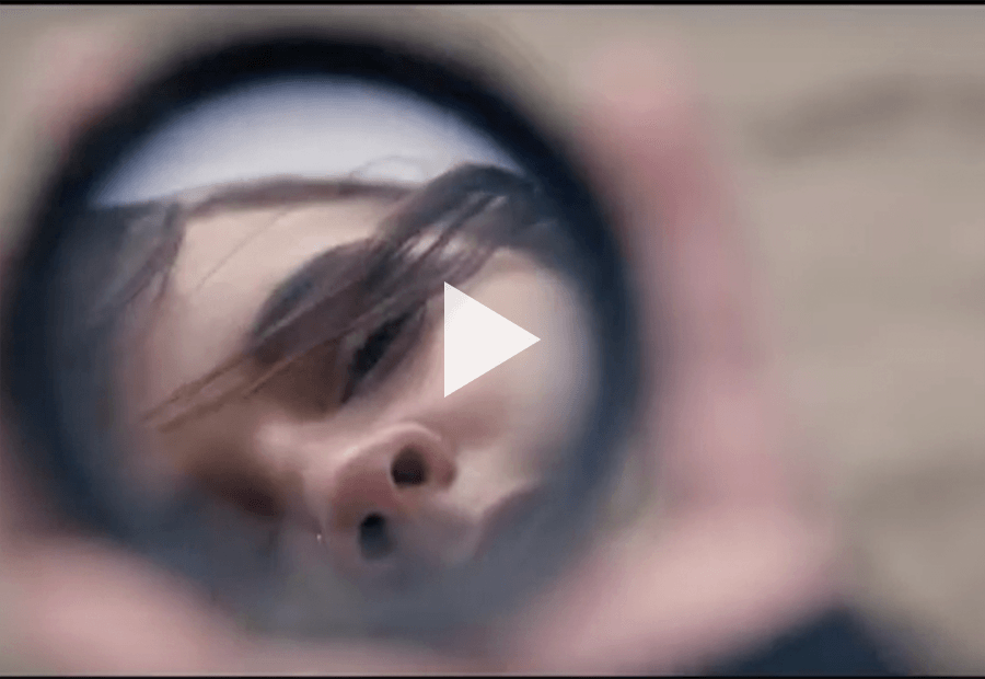 girl looking at her self in a mirror