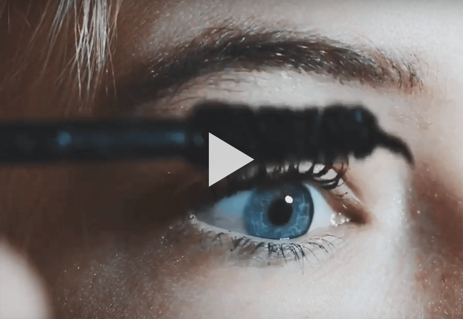 putting on mascara on eyelash