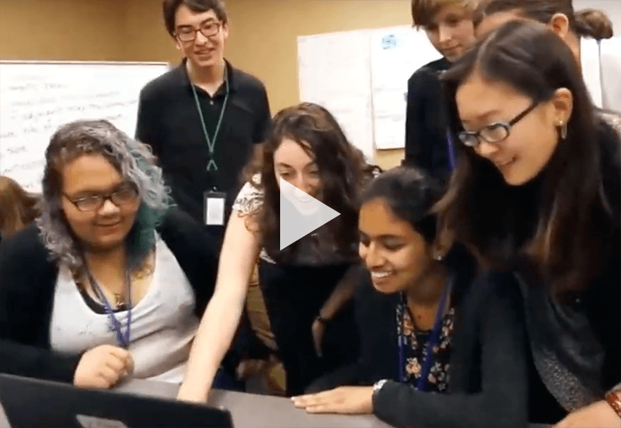 a group of ladies in front of a laptop